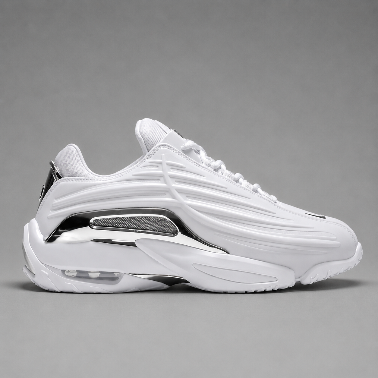 NOCTA Glide White Chrome – Blanc / Chrome Argent